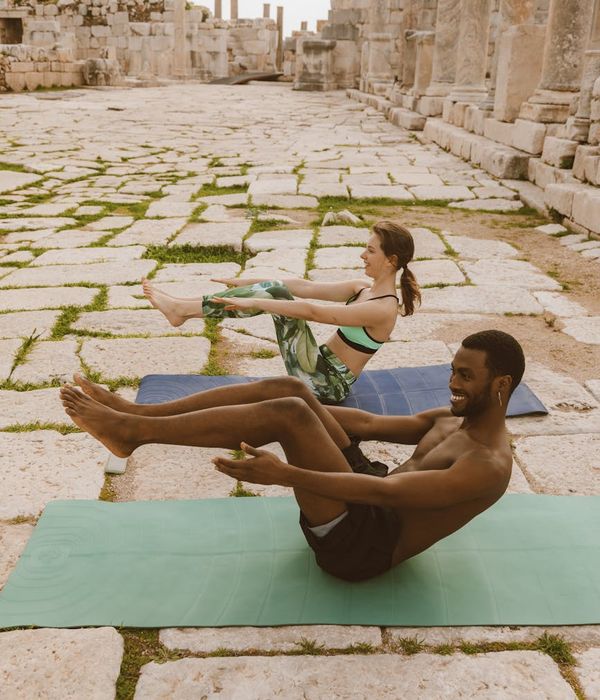 A group of diverse people smiling and feeling refreshed after a workout session.